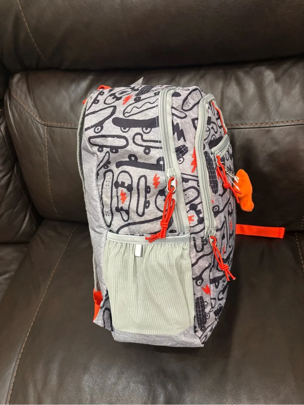 New with tags Kids Skateboard Print Backpack in Gray with Orange Accents